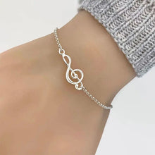 Load image into Gallery viewer, Adjustable Treble Clef Bracelet - Unique Music-Inspired Symbol, Adjustable Length for Comfortable Fit - Shiny Silver Tone Finish